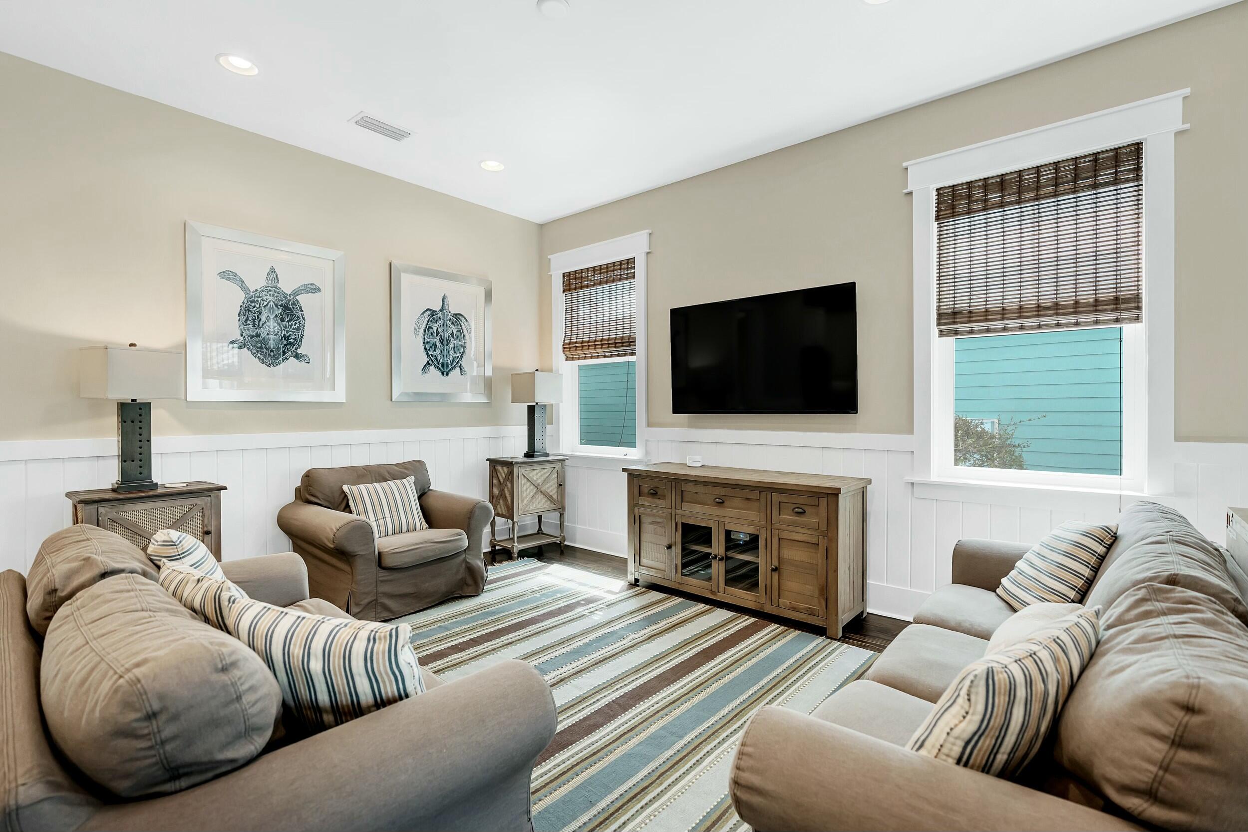 673 Flatwoods Forest Loop Santa Rosa Beach, FL 32459 - Photo 4 of 41 a living room with furniture flat screen tv and a fireplace