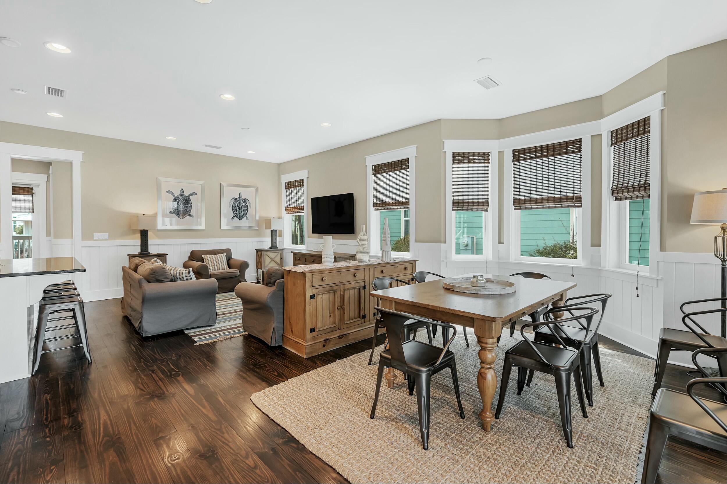 673 Flatwoods Forest Loop Santa Rosa Beach, FL 32459 - Photo 5 of 41 a view of a dining room with furniture window and wooden floor