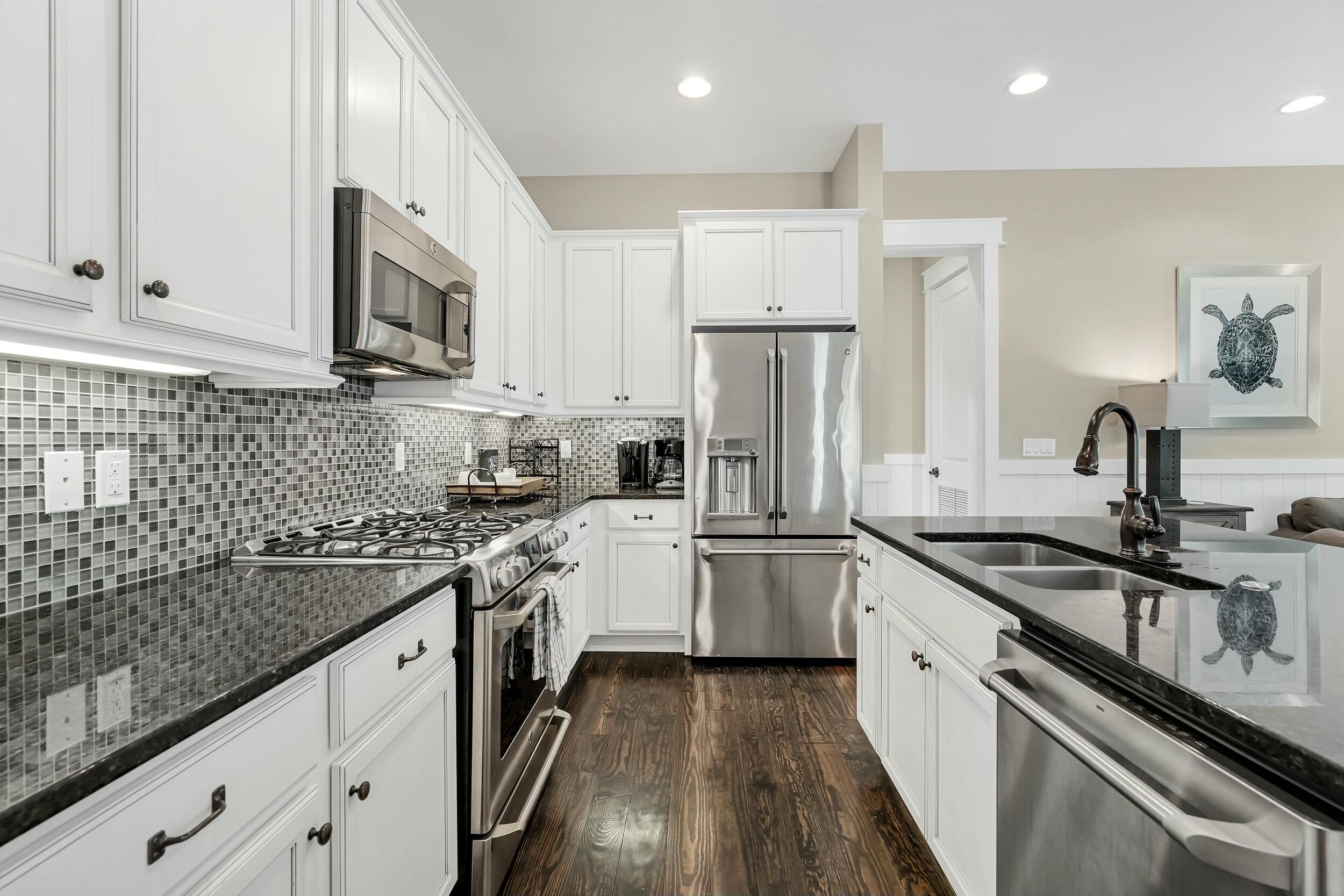 673 Flatwoods Forest Loop Santa Rosa Beach, FL 32459 - Photo 9 of 41 a kitchen with a sink stove and refrigerator