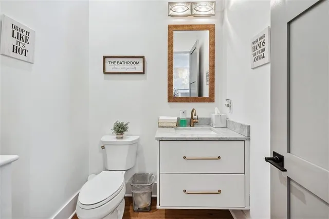 a bedroom with a bed window and a flat screen tv