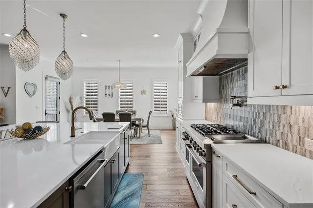 a spacious bathroom with a double vanity sink a mirror and shower