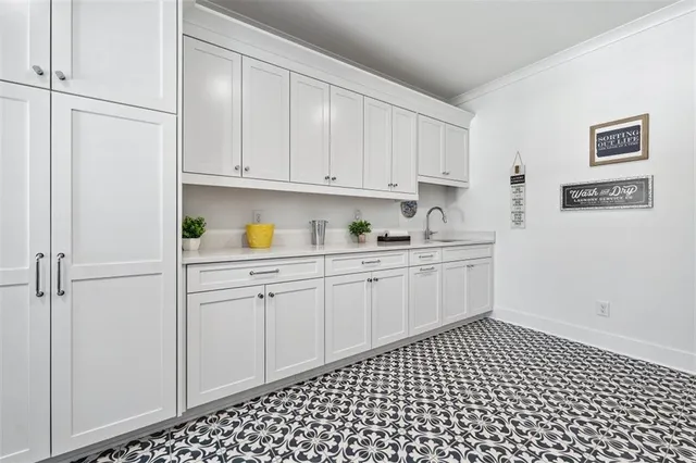a bathroom with a double vanity sink toilet mirror and shower