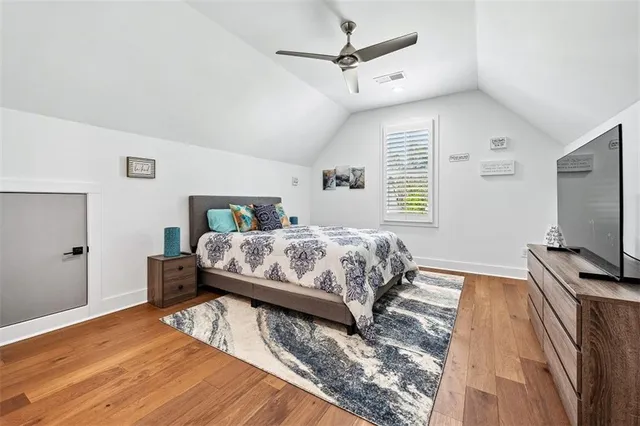 a living room with furniture a lamp and a table