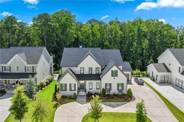 a large kitchen with a table and chairs