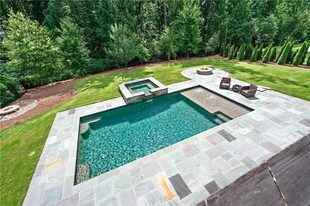 a living room with furniture fireplace and flat screen tv