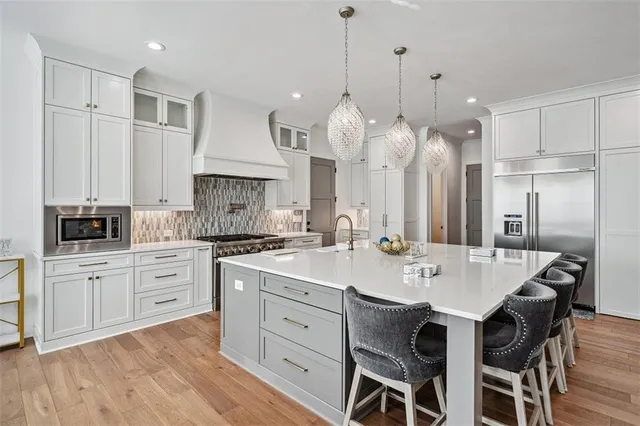 a view of a kitchen with a sink and cabinets