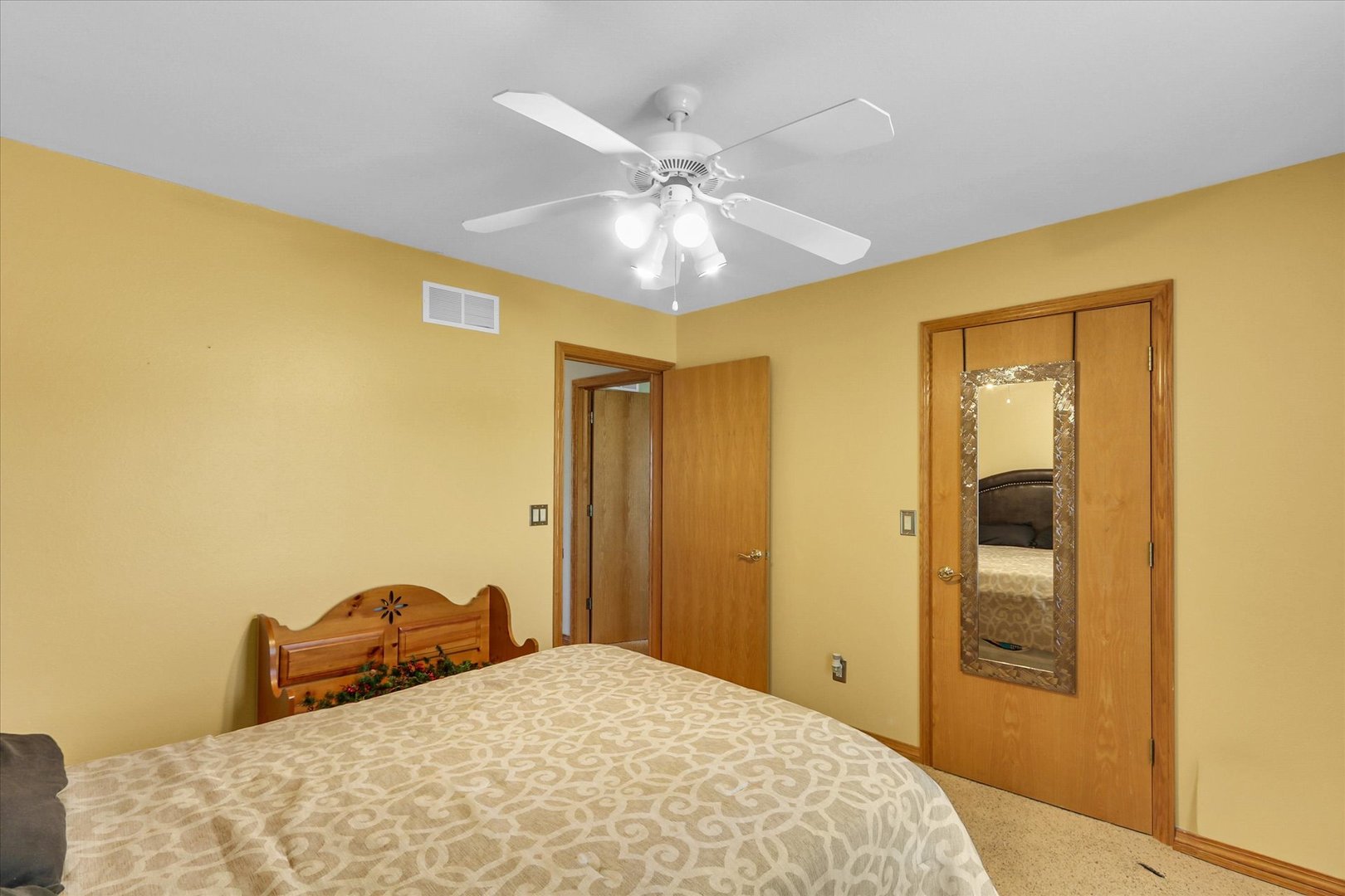 3110 Ridge Park Road Urbana, IL 61802 - Photo 16 of 26 a bedroom with a bed and a chandelier