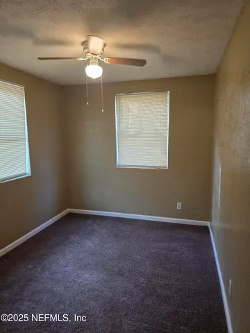 a bathroom with a glass door shower