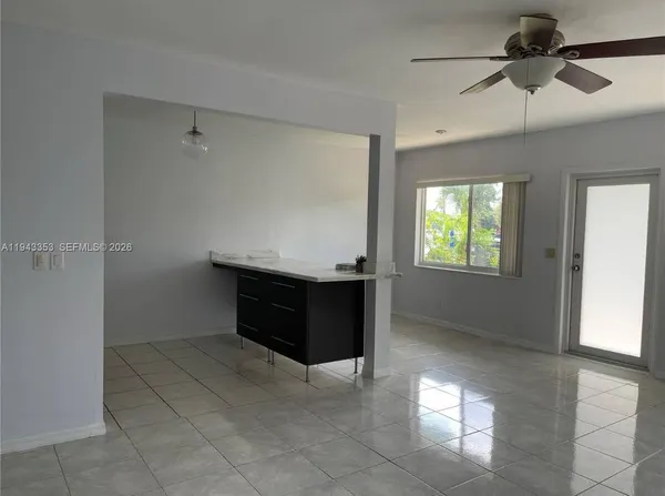 a room with window and a ceiling fan