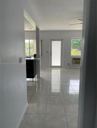 a view of livingroom with furniture and windows