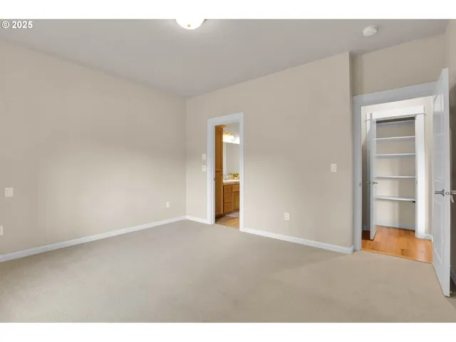 a view of an empty room and a window