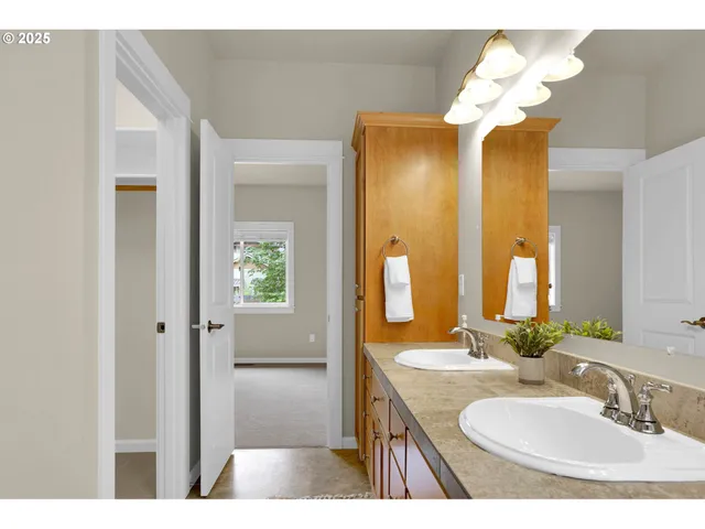 a bathroom with a sink a vanity and a mirror