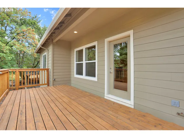 a view of backyard with a deck