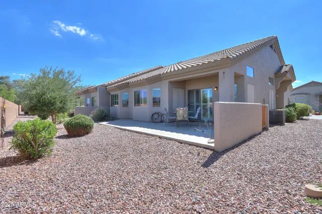 a view of swimming pool with outdoor seating and a yard