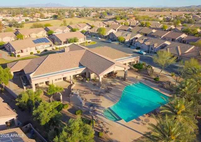 a living room with a book shelf and a book shelf