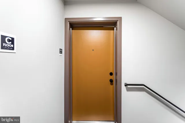 a bathroom with a shower and a door