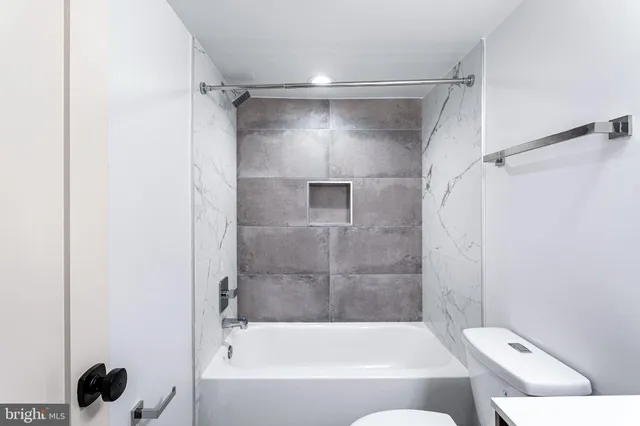 a bathroom with a shower and a bathtub