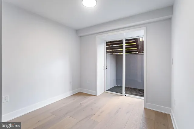 an empty room with wooden floor