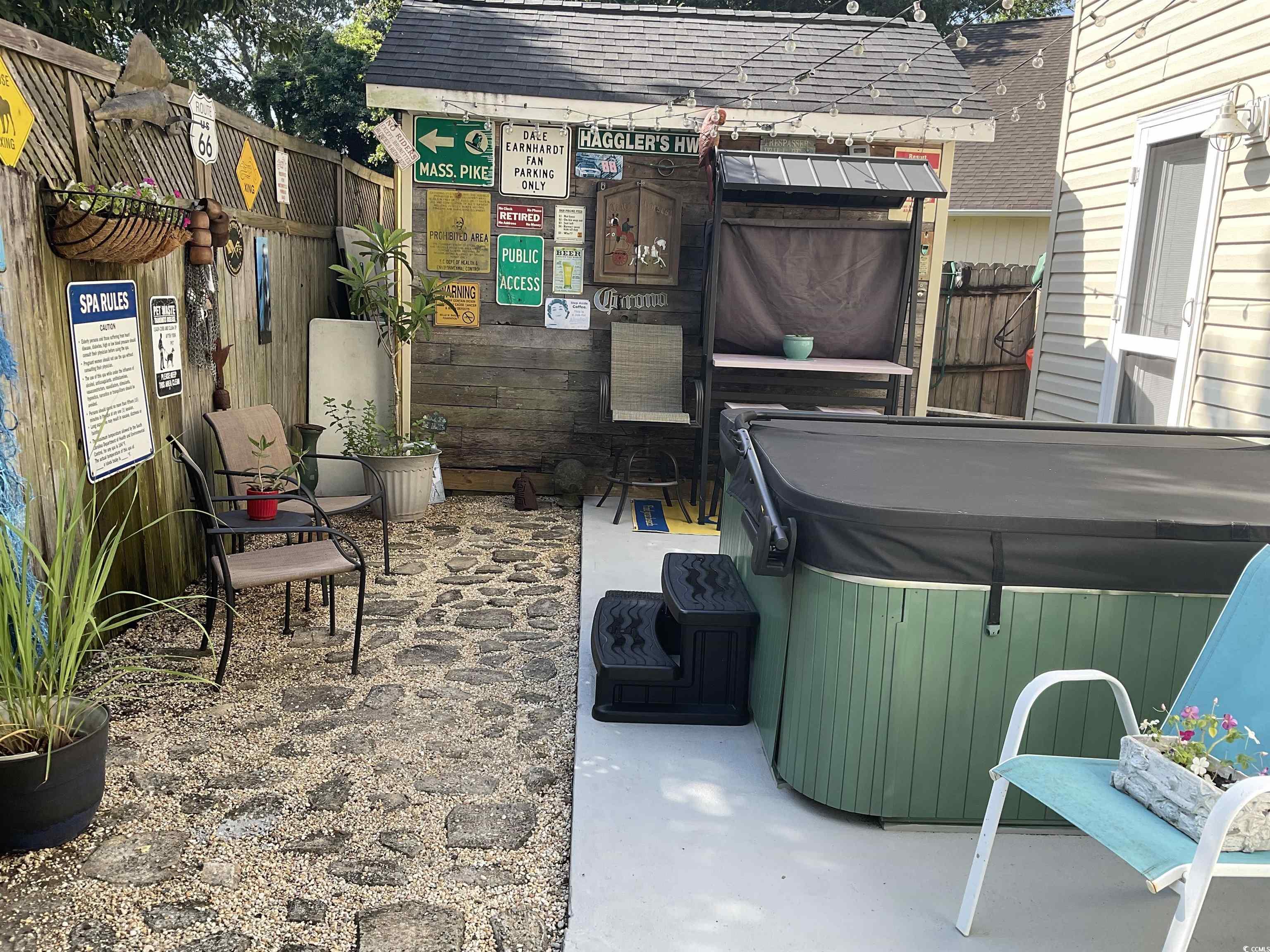 804 Brenda Place Myrtle Beach, SC 29577 - Photo 30 of 39 View of patio / terrace with a hot tub