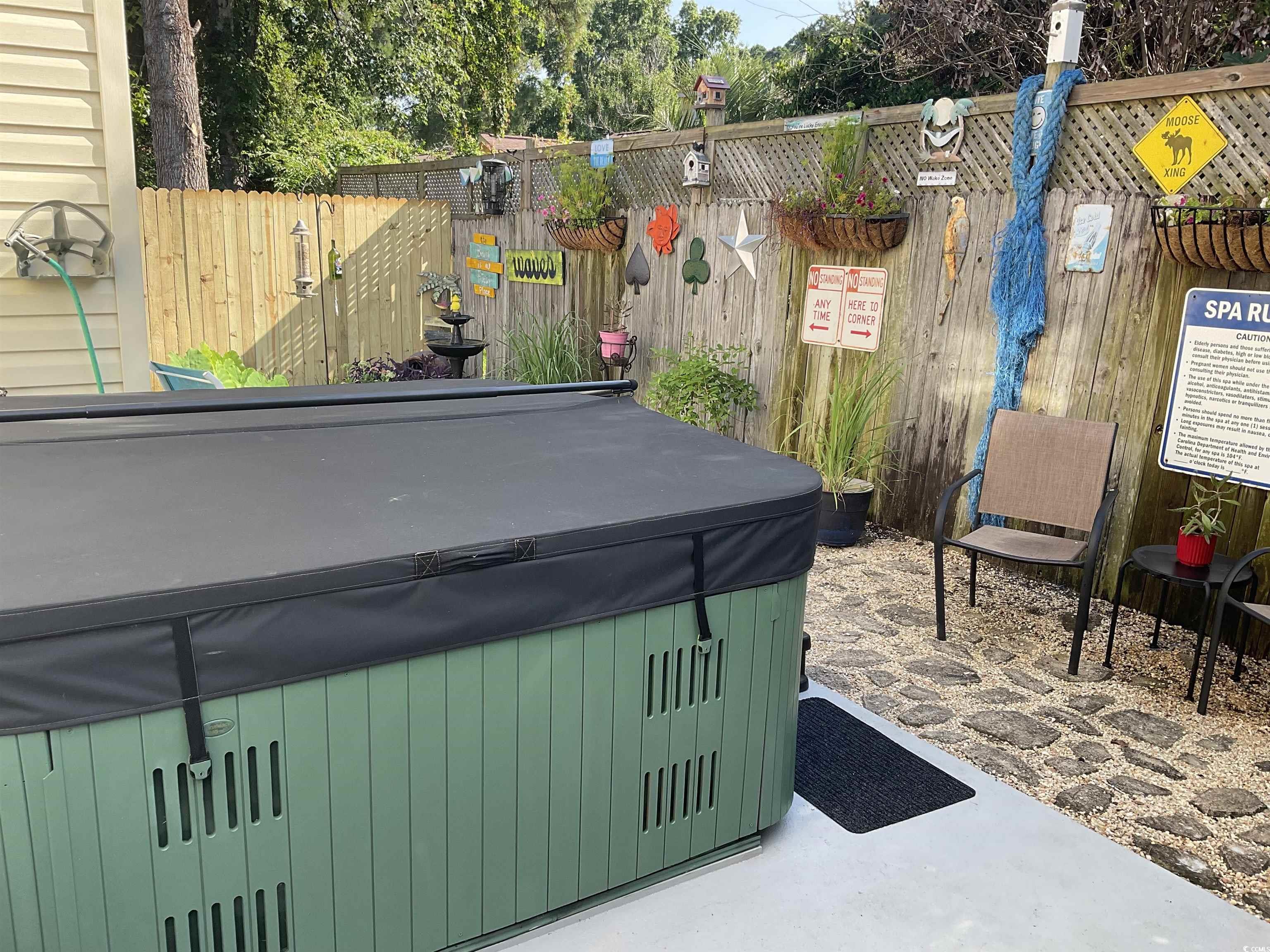 804 Brenda Place Myrtle Beach, SC 29577 - Photo 31 of 39 View of patio featuring a hot tub