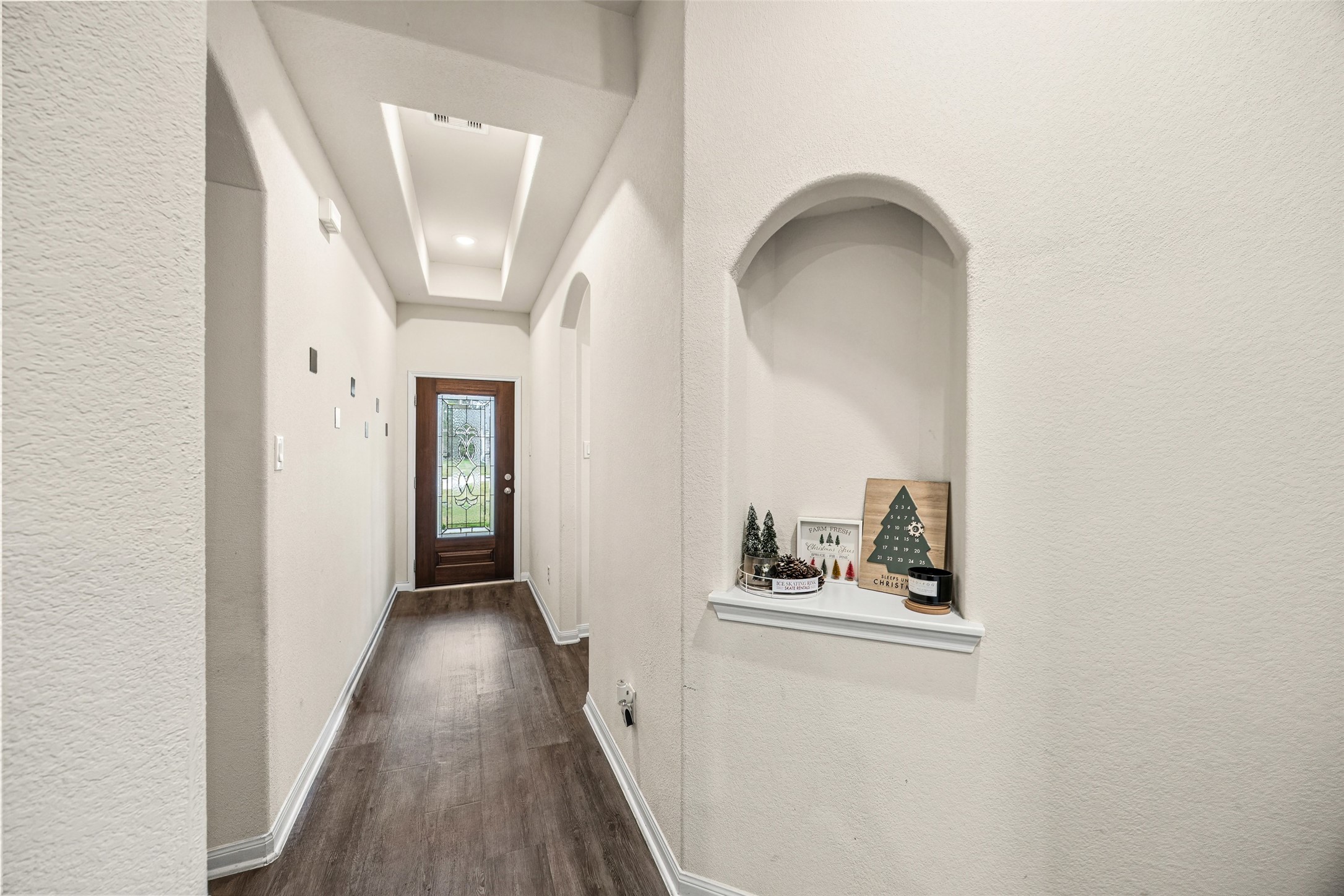 156 County Road Cleveland, TX 77327 - Photo 6 of 26 a view of a hallway with wooden floor and staircase