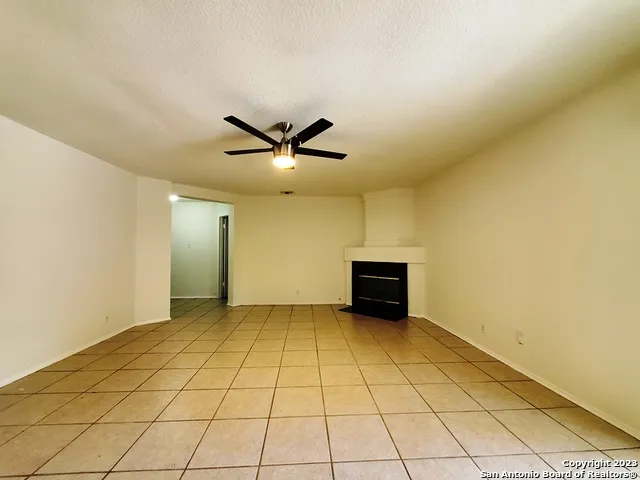 an empty room with a empty space and windows