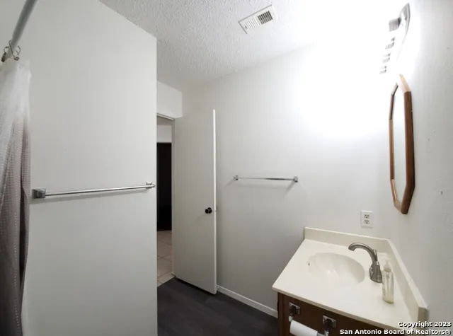 a bathroom with a sink and tub