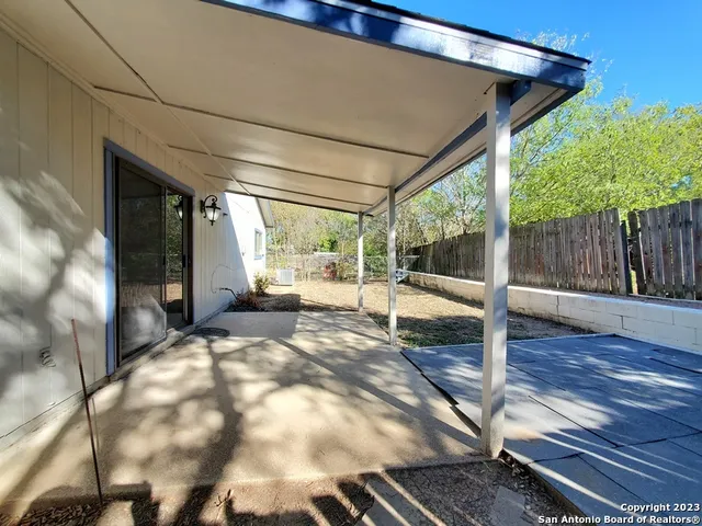 a view of porch with wooden floor