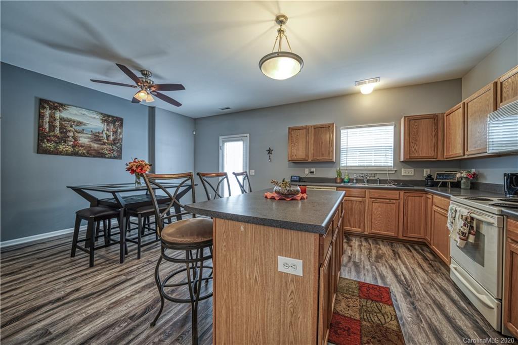 808 Dillard Road Rock Hill, SC 29730 - Photo 11 of 29 a kitchen with granite countertop lots of counter top space and dining table