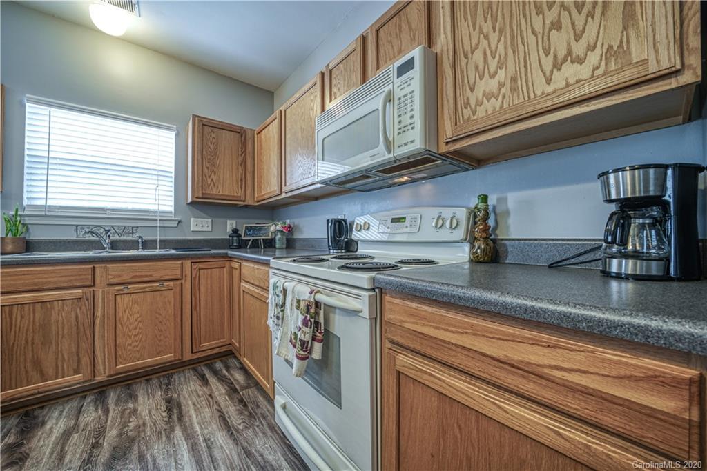 808 Dillard Road Rock Hill, SC 29730 - Photo 13 of 29 a kitchen with stainless steel appliances granite countertop a sink and cabinets