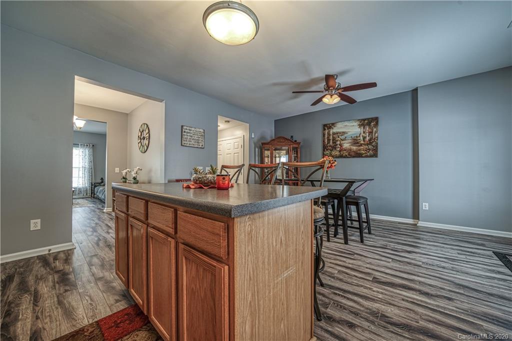 808 Dillard Road Rock Hill, SC 29730 - Photo 14 of 29 a kitchen with stainless steel appliances granite countertop a dining table chairs and a refrigerator