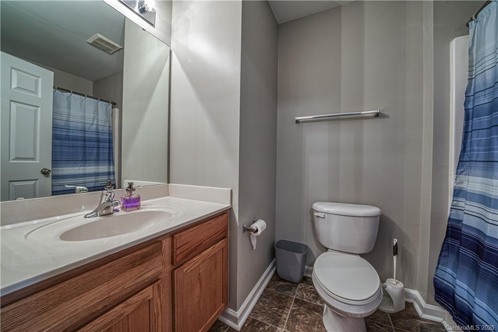808 Dillard Road Rock Hill, SC 29730 - Photo 27 of 29 a bathroom with a sink toilet and vanity