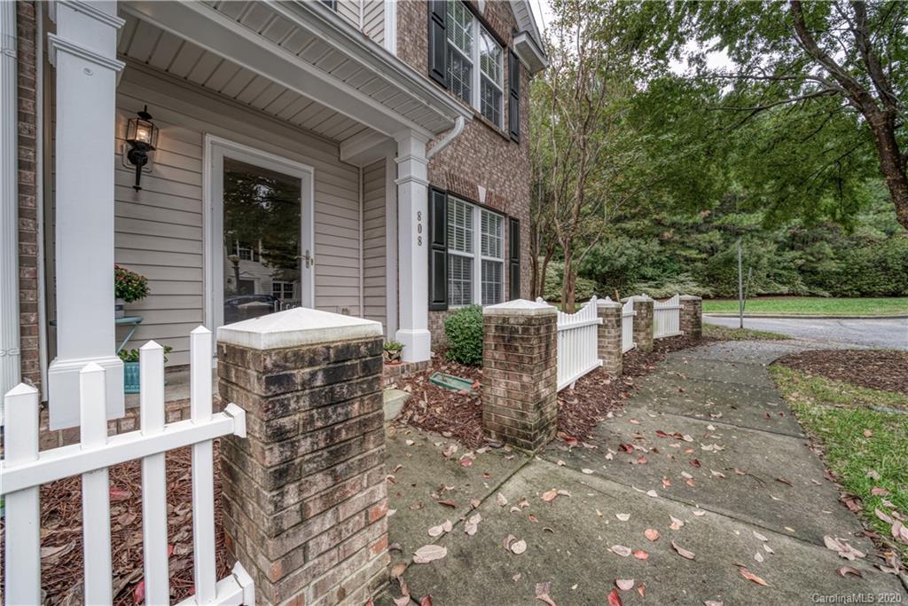 808 Dillard Road Rock Hill, SC 29730 - Photo 4 of 29 a view of a patio with table and chairs and wooden fence