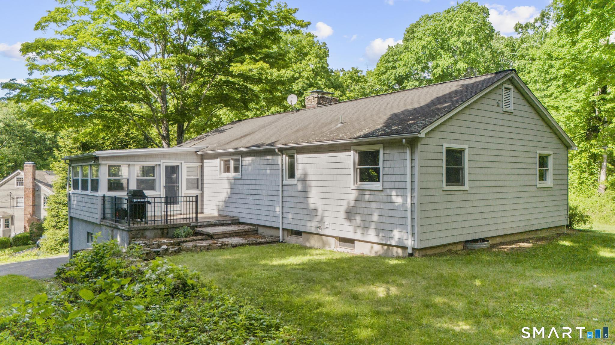 200 Old Huckleberry Road Wilton, CT 06897 - Photo 23 of 24 a view of a house with a yard