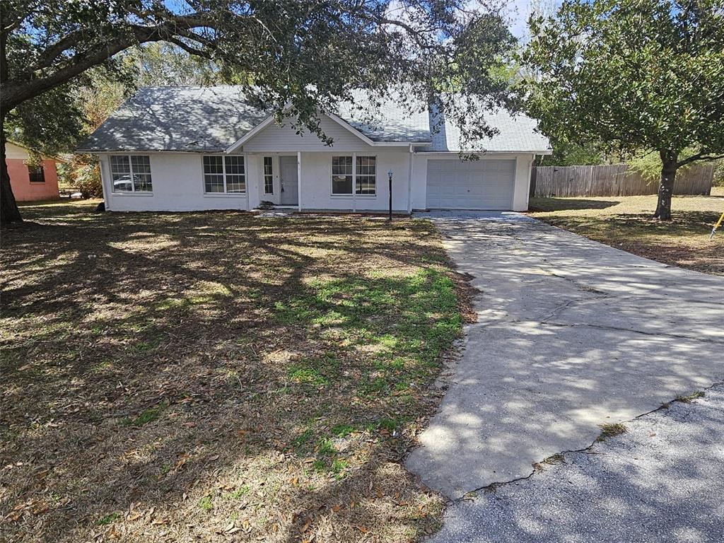 4 Cedar Trace Way Ocala, FL 34472 - Photo 1 of 36 a front view of a house with a garden