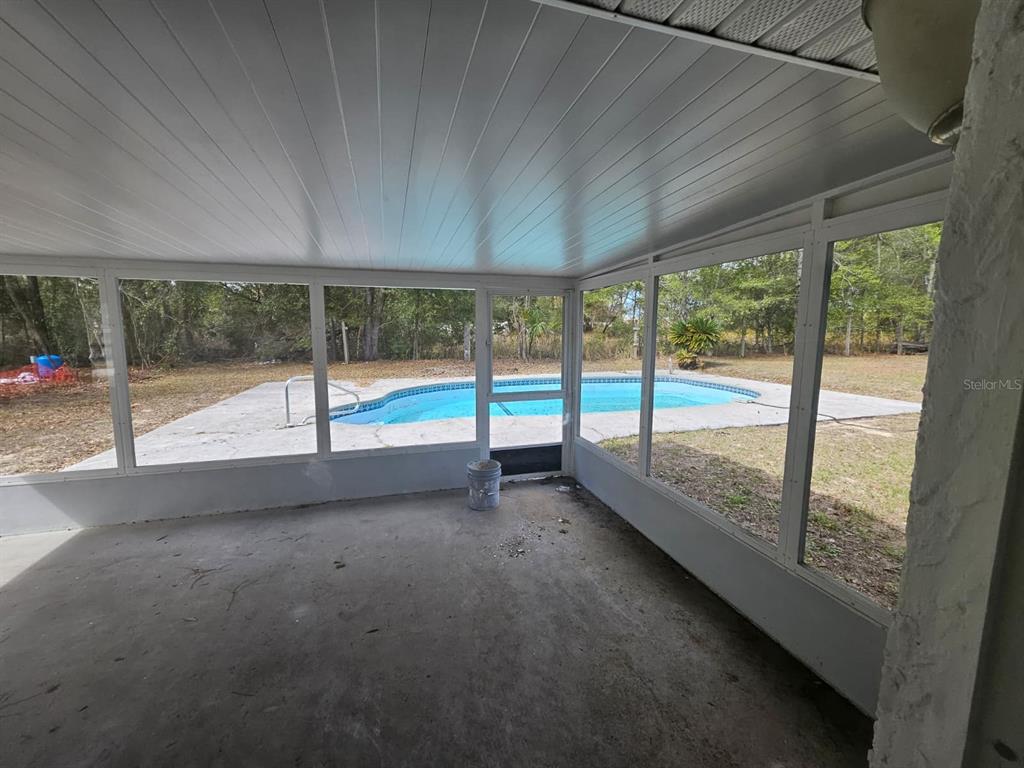 4 Cedar Trace Way Ocala, FL 34472 - Photo 18 of 36 a view of an empty room with balcony