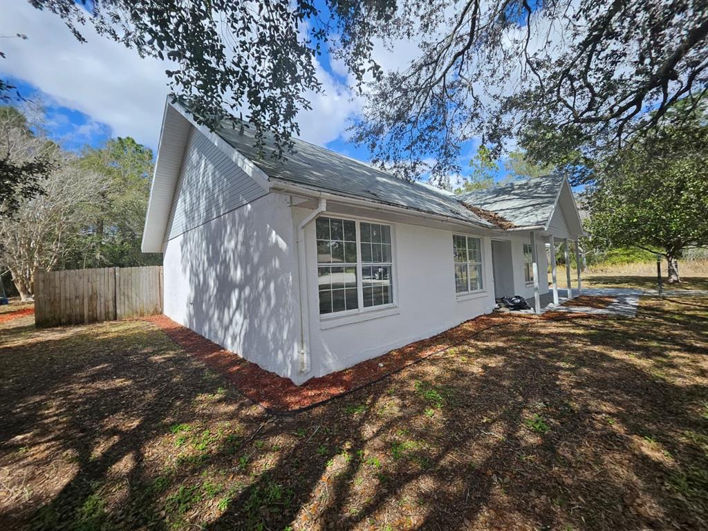 4 Cedar Trace Way Ocala, FL 34472 - Photo 2 of 36 a view of a house with a tree in front of it