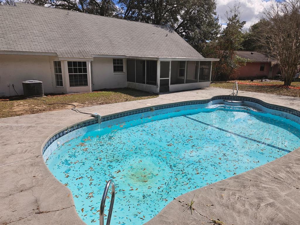 4 Cedar Trace Way Ocala, FL 34472 - Photo 27 of 36 a front view of house with yard and trees in the background