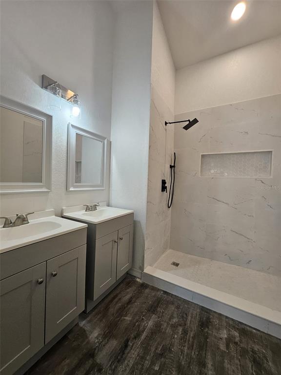 4 Cedar Trace Way Ocala, FL 34472 - Photo 33 of 36 a bathroom with a double vanity sink mirror and shower