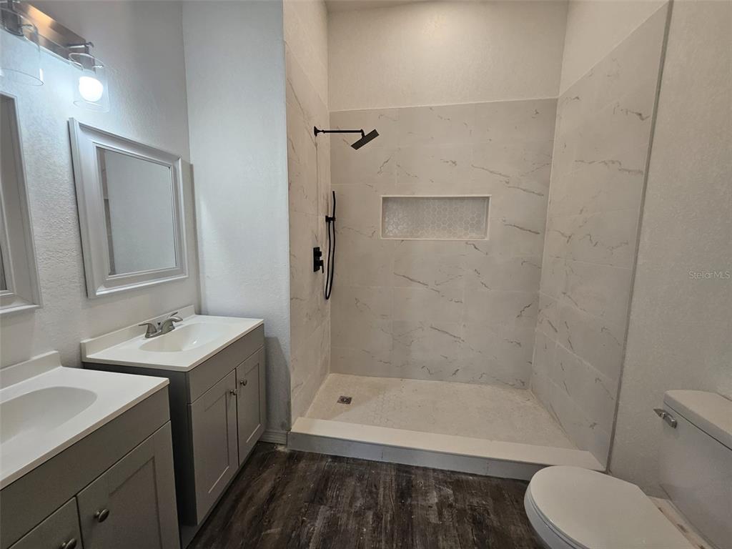 4 Cedar Trace Way Ocala, FL 34472 - Photo 35 of 36 a bathroom with a bathtub shower sink mirror and toilet