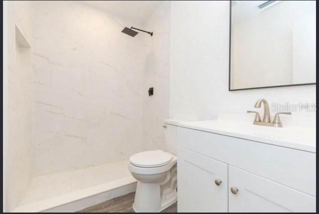 4 Cedar Trace Way Ocala, FL 34472 - Photo 9 of 36 a bathroom with a sink a toilet and a mirror