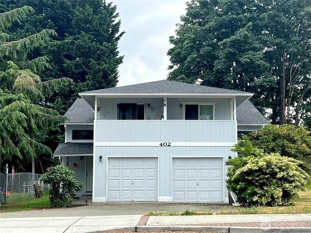 a front view of a house with a garage