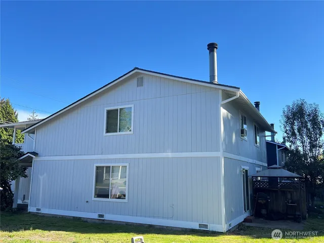 a backyard of a house with lots of green space