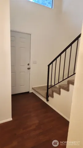 a view of entryway with wooden floor