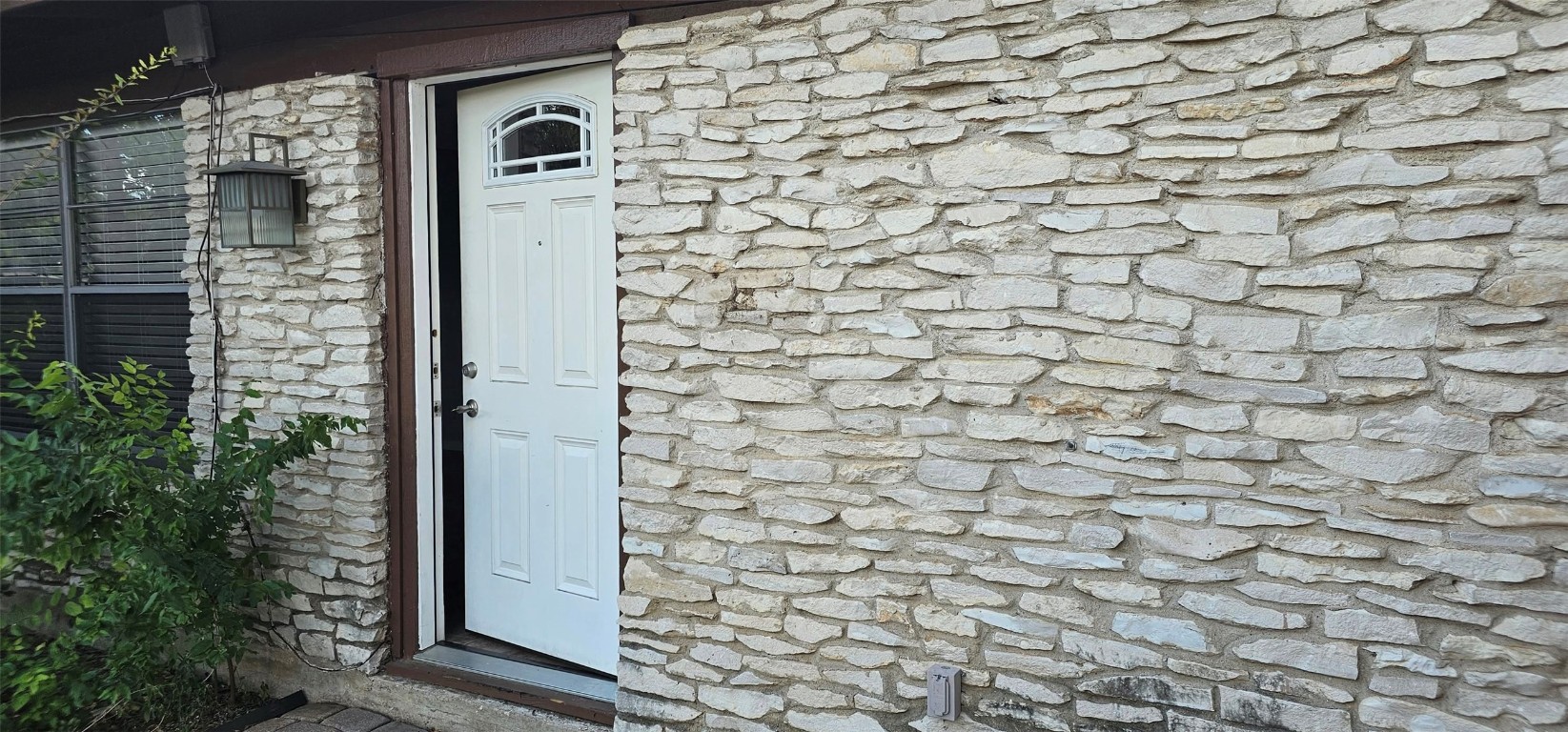 1411 Braes Ridge Drive, Unit B Austin, TX 78723 - Photo 2 of 37 closeup of a brick wall