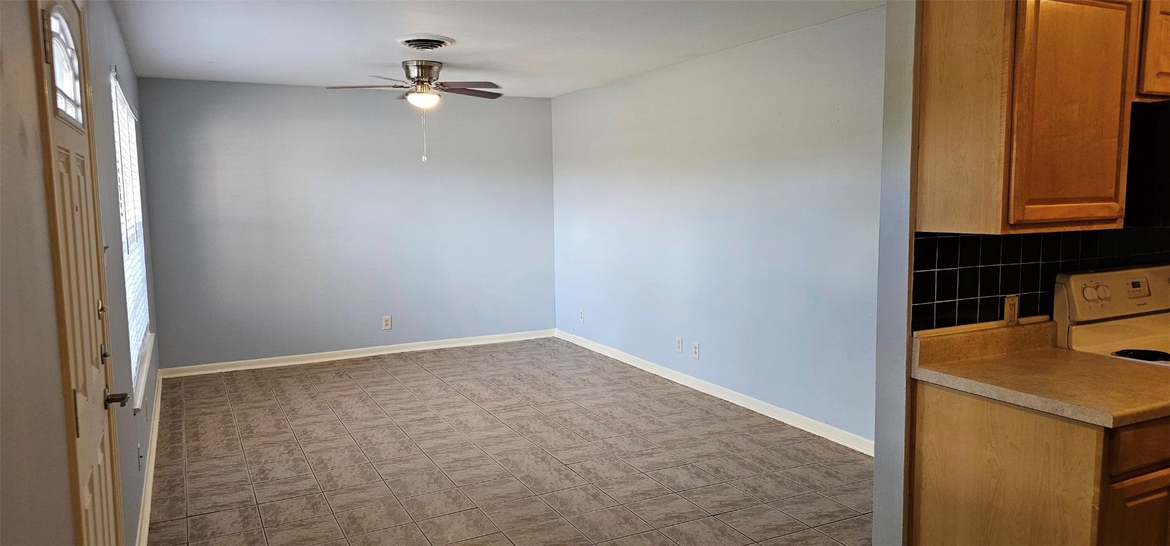 1411 Braes Ridge Drive, Unit B Austin, TX 78723 - Photo 24 of 37 an empty room with a ceiling fan and a window