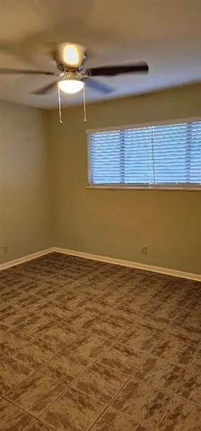 a kitchen with a sink a refrigerator and cabinets