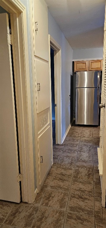 1411 Braes Ridge Drive, Unit B Austin, TX 78723 - Photo 32 of 37 a view of a refrigerator in kitchen and an empty room