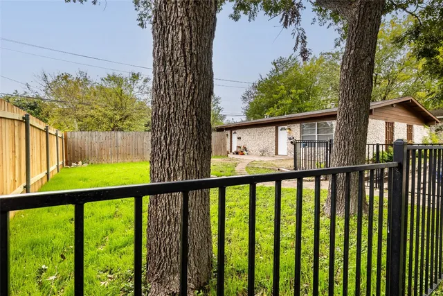 a view of a small yard from a balcony