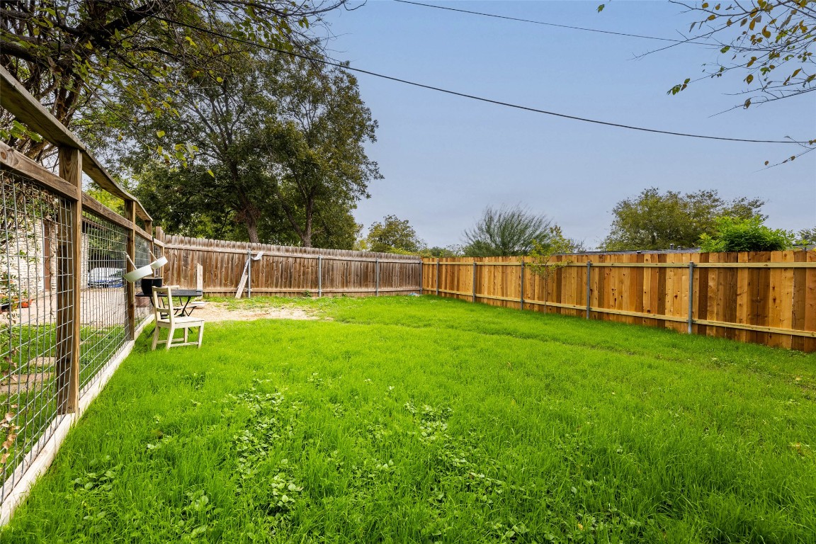 1411 Braes Ridge Drive, Unit B Austin, TX 78723 - Photo 6 of 37 a view of yard with grass and trees
